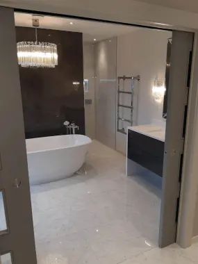 Completed bathroom installation with freestanding bath